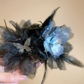 Detailed view of hair clip with blue iridescent flower, black mesh, and feather tassels - Butterfly Feather Mesh Claw Clip / Black