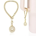 Golden Cuban chain with zircon iced-out bubble letter charm hanging on a pink handle - Round