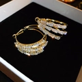 Macro shot of three-row gold hoop earrings with sparkling rectangular cut crystals - Gold Crystal Hoop Earrings (S925 Pin)