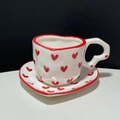 Irregular white ceramic cup and heart-shaped saucer set with red heart patterns - Big Red Heart Cup & Saucer