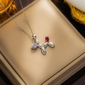 Silver stainless steel balloon dog necklace with red and blue gemstone insets in box - 8949 Steel Colored Balloon Dog