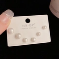 Three pairs of white pearl earrings in different sizes on elegant black background - Shell Pearl Set (111#)
