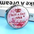 Pink quicksand pocket mirror with crown design and Not A Day Over Fabulous text - Quicksand "NOT A DAY OVER Fabulous" Crown Style