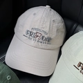 Close-up of bear embroidery and letter detailing on breathable cotton baseball caps - Light Pink