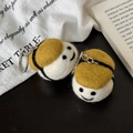 Handmade wool felt smiley face doll keychain charm with yellow hat on dark surface - Sea Urchin Sushi