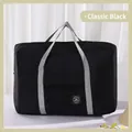 Classic black foldable travel bag with gray reinforced straps and front zipper pocket - Black