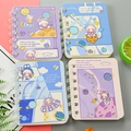 Mini A7 spiral notebooks featuring purple blue and pink cartoon astronaut bear designs - Cosmic Bear