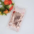 Detailed macro view of rose gold foil fringe curtain with decorative flowers for party decor - 1*2m Champagne Gold