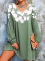 Detail view of floral print long sleeve V-neck dress with lantern sleeves in green and white - S / Dresses / Green
