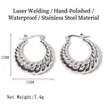 Polished 25mm silver stainless steel croissant hoop earrings with twisted texture details - Hollow Twist Round Hoop Earrings / Steel