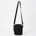 Minimalist black nylon crossbody sports bag with adjustable strap and front zipper - Black