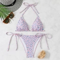 Flat lay of floral pink bikini set with halter top and tie-side bottoms on marble background - S / Purple with Blue Flowers
