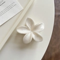Chic cream white plumeria flower hair claw clip with pearlescent marble texture - White