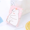 Blocco per appunti rosa con orsetto dei cartoni animati su una scrivania bianca - Orso Polare