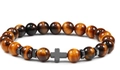 Macro shot of tiger eye beads and dark metal cross charm on professional beads bracelet - Tiger Eye Stone Bracelet