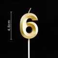 Detail of a golden number 6 birthday candle with 4.8cm height measurement on black backdrop - Gold Number 6