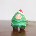 Wooden Christmas tree figurine with red hat, green coat, and 7.5cm height dimension - Pine Tree Doll
