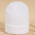 Winter warm knitted beanie in solid white color featuring a ribbed texture and cuffed hem - M (56-58cm) / Pure White