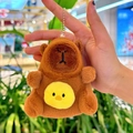 Cute brown capybara plush keychain with a yellow chicken detail held in hand - Holding Chick Dark Brown + Bead Chain