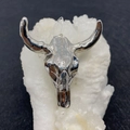 Macro detail of a silver bull head skull charm pendant for DIY necklace making - No.6 Silver Textured