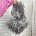 Detail view of light grey faux fur heart-shaped bag with soft texture and long plush - Small / Light Gray
