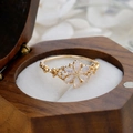 Detail of rose gold flower ring with pink opal petals and diamond accents in a jewelry box - US Size 6 / Gold Synthetic Opal