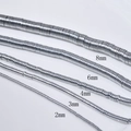 Makroaufnahme von silbernen Hämatit-Zwischenperlen in fünf Größen von 2mm bis 8mm - 2*1mm/Ca. 380 Stück / Silber