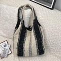 Detail of black and white fuzzy tote bag showing plush texture and metal snap closure - Lamb Wool Wide Stripe Style / Black and White Coarse Stripe