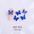 Macro view of 3D blue crystal butterfly nail charms with MZH-M18 model markings - Royal Blue + Rose Gold Base