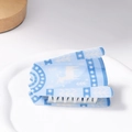 Blue and white Christmas hair claw clip with elk and snowflake patterns on a tray - Blue White Winter Deer