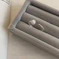 Minimalist silver open ring with white pearl featured in a grey velvet jewelry box - Open Pearl Inlay Metal Ring (J3778)