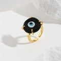 Detailed view of adjustable gold evil eye ring with black resin inlay and blue glass pupil - Black (ZYN-DMR146G-1)