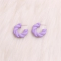 Elegant purple twisted C-shape hoop earrings with matte finish on white plush background - Small Purple Twisted