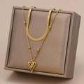 Collana a strati dorata con catena a serpente, filo di perle e ciondolo a cuore - Bracciale a Catena Lama Cuore