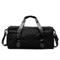 Black checkered travel duffel bag with dual handles and detachable shoulder strap - Black