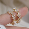 Elegant gold flower hoop earrings with white pearls and colorful crystal accents - Hollow Pearl Flower Earrings / Gold