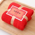 Red coral velvet towel folded as a gift with golden ribbon and Chinese wedding card - Red Wedding Joy