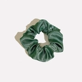 Macro shot of dark green satin scrunchie showing glossy pleated silk texture and soft folds - Satin 37 (Dark Forest Green)