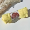 Bright yellow pleated cotton viscose shawl wrapped with a floral pattern paper sleeve - Style #94