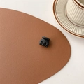 Detailed close-up of a matte black mini hair claw clip on a stylish desk setting - Matte Black (Small Approx. 2cm)