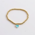 Detail of gold-plated beaded elastic bracelet with sky blue enamel heart charm - Light Blue