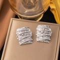 Minimalist irregular striped stud earrings in metallic silver finish for a modern look - Silver