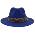 Detail of bright blue cowboy hat with turquoise beads and bohemian tassels decoration - Blue