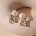 Detailed view of gold plated earrings featuring square zircon and white double pearls - Silver Pin - White Square Zirconia Pearl Stud Earrings