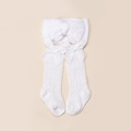 Close-up of white knit baby headband and hollow socks with bow details for newborns - White