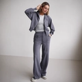 Dames sportpak in donkergrijs blauw met ritsjasje en wijde broek met hoge taille - S / Grijs