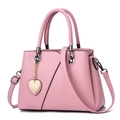 Chic pink PU leather handbag with V-stitch design and heart pendant detail - Pink