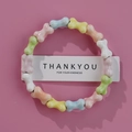 Handmade ceramic bracelet with colorful bone shaped beads on a pink background - Color Bone Beaded (1586-02)