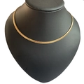 Golden wavy sand textured flat chain necklace displayed on a black neck bust model - 4mm / Gold