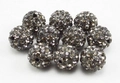 Macro detail of 8mm smoky grey pavé clay disco beads for jewelry making and crafting - Smoke Gray